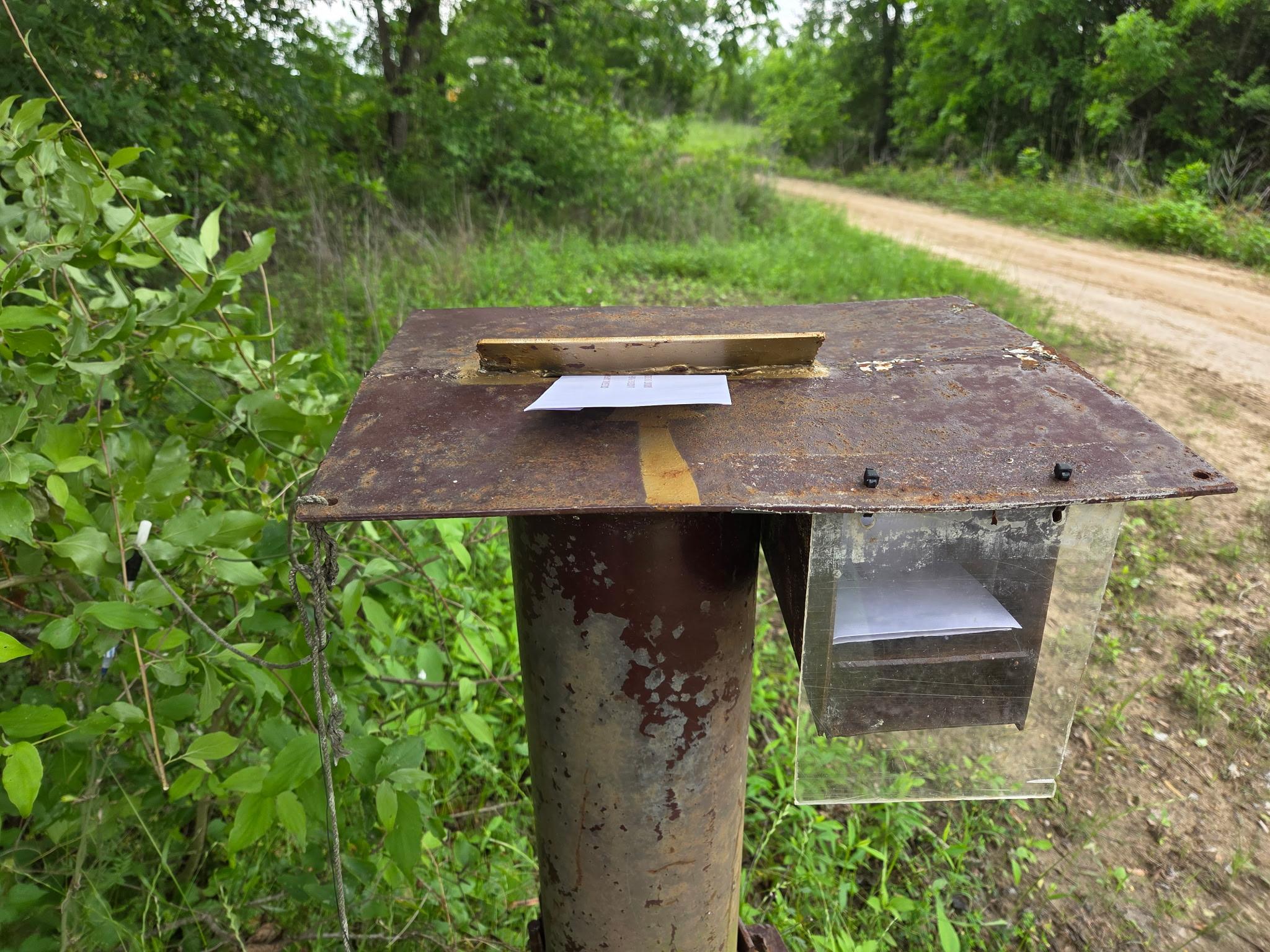 Envelope placed on the pay station ready to be dropped in the slot