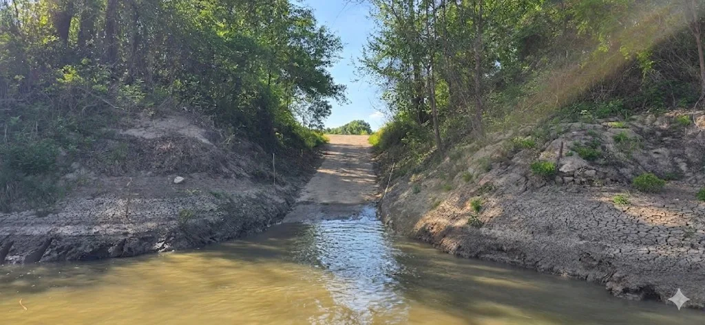 Empty Trinity River boat ramp at low water